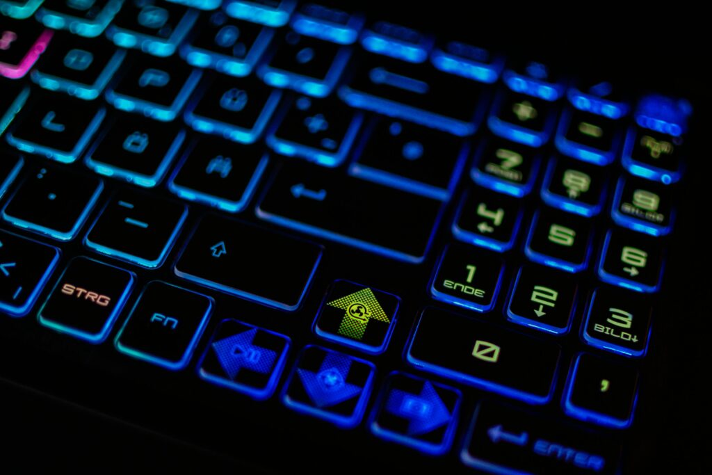 Close-up of a backlit RGB gaming keyboard, emphasizing vibrant colors and modern design.